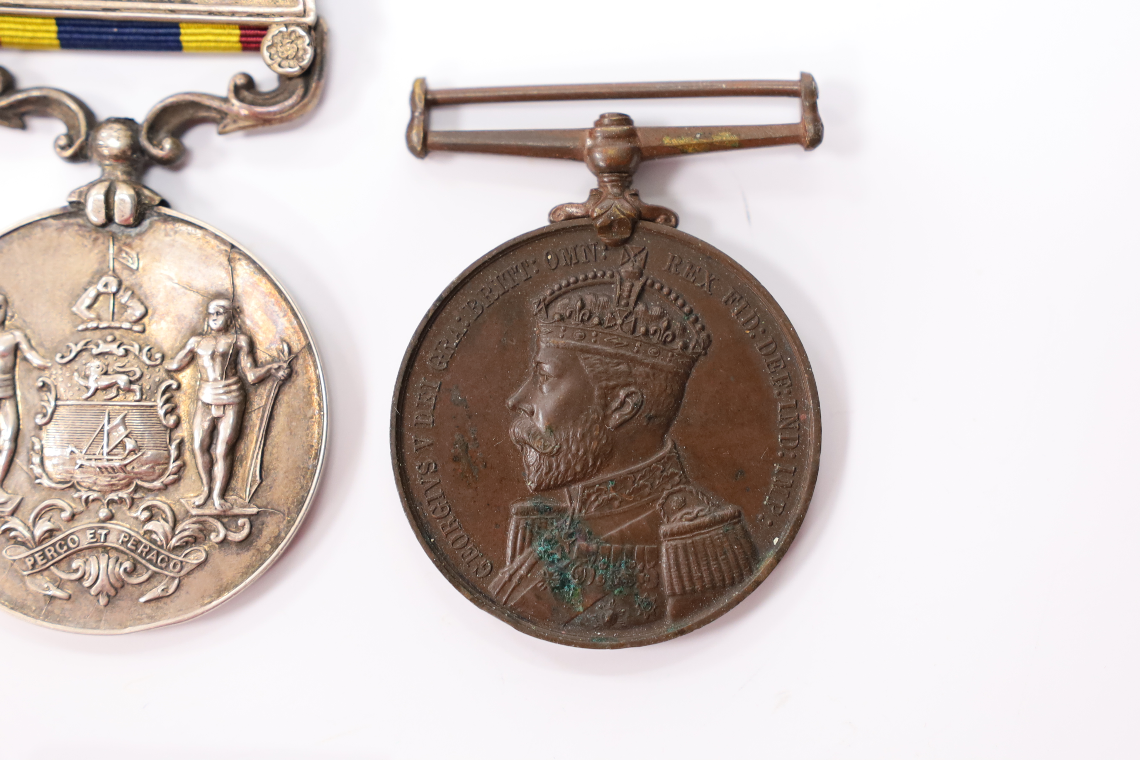 Assorted medals; two replica British North Borneo medals; Balaklava medallion; bronze GV medal; German China Campaign medal; bronze NRA medallion, unnamed